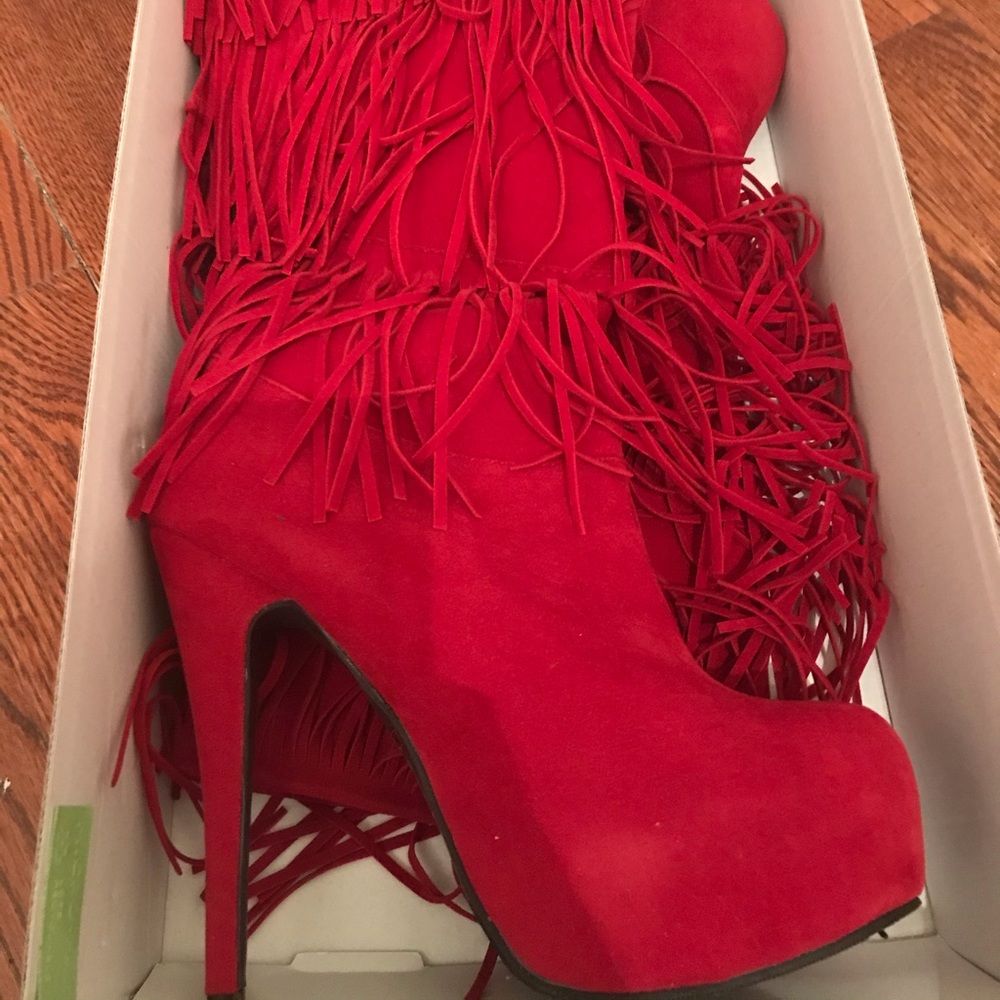 Knee high fringe heel boots